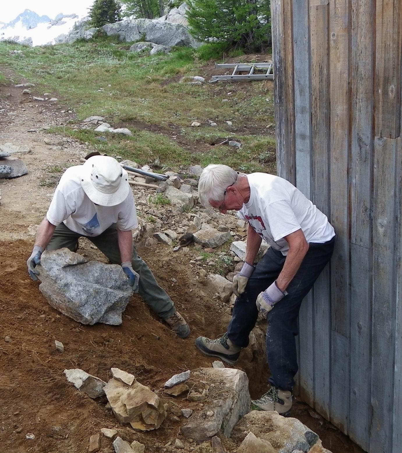 Eric (L) and Maurice building the retaining wall.
